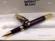 Montblanc Writers Edition Daniel Defoe Rollerball Pens Gold and Red (5)_th.jpg